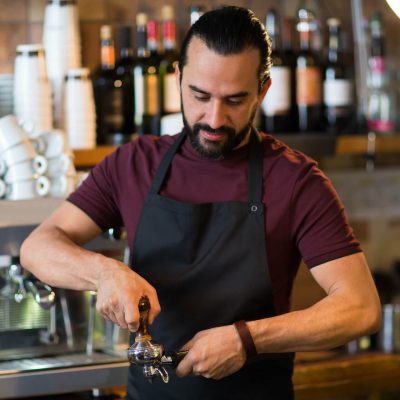 barista-man-making-espresso-at-bar-or-coffee-shop-2022-12-16-09-39-23-utc.jpg