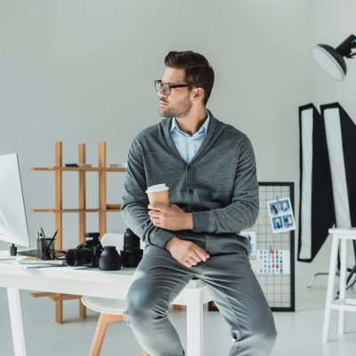 handsome-male-photographer-with-coffee-working-in-2022-12-16-18-18-50-utc-1.jpg