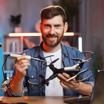 happy-smiling-caucasian-man-using-soldering-iron-f-2021-09-04-08-13-33-utc-e1697778801370.jpg